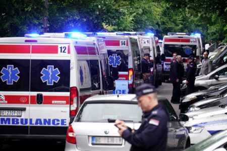 Ambulances and police officers outside the Vladislav Ribnikar primary school in Belgrade, Serbia, 3 May 2023. Image: Oliver Bunic / AFP