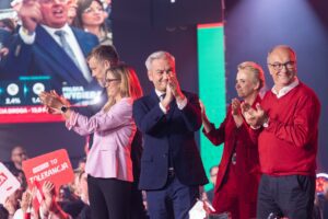 Pictured from left: Adrian Zandberg, Magdalena Biejat, Robert Biedroń, Joanna Scheuring Wielgus, and Włodzimierz Czarzasty celebrate at a Lewica event on election night. Photo: Lewica / Flickr.