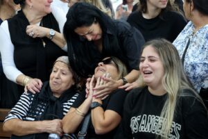 Family members mourn Naor Hassisim, a victim of the Kibbutz Kfar Aza attack last week by members of Hamas. Thousands of people, both Israeli and Palestinians, have died since Hamas entered southern Israel in a surprise attack which led Israel to declare war on Hamas in Gaza on October 8. Photo: GIL COHEN-MAGEN / AFP